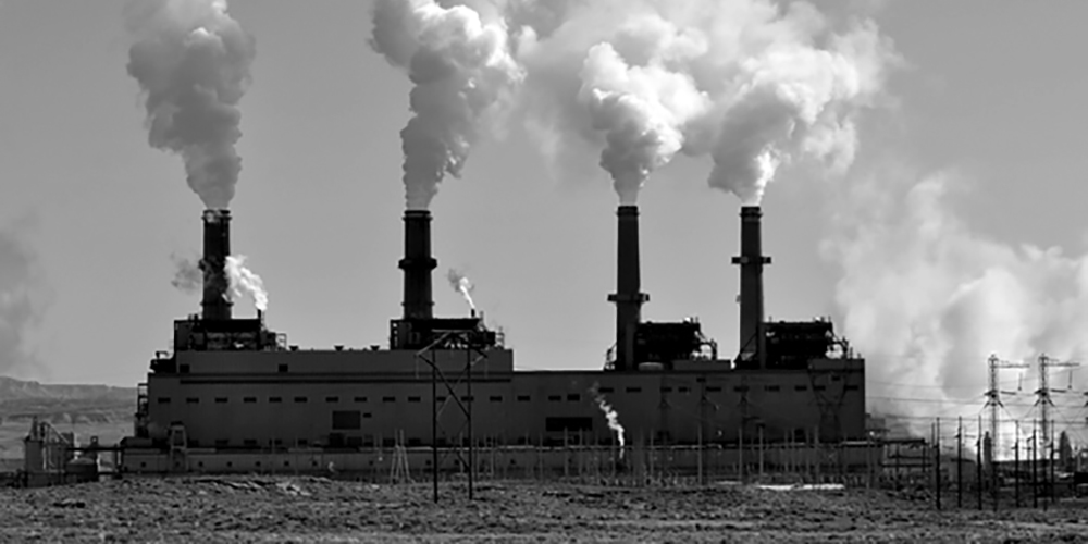 Coal reels as wind and solar rise Photo of San Juan Power Plant for Sierra Club article on PNM's utility rate hike proposal rejected by the NM PRC